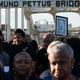 A person holds up a photo of the late Reverend Martin Luther King Jr. marching across the Edmund Pettus Bridge in commemoration of the 57th anniversary of ‘Bloody Sunday’ in Selma, Alabama, on March 6, 2022.